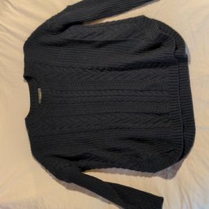 Women's blue cable knit sweater